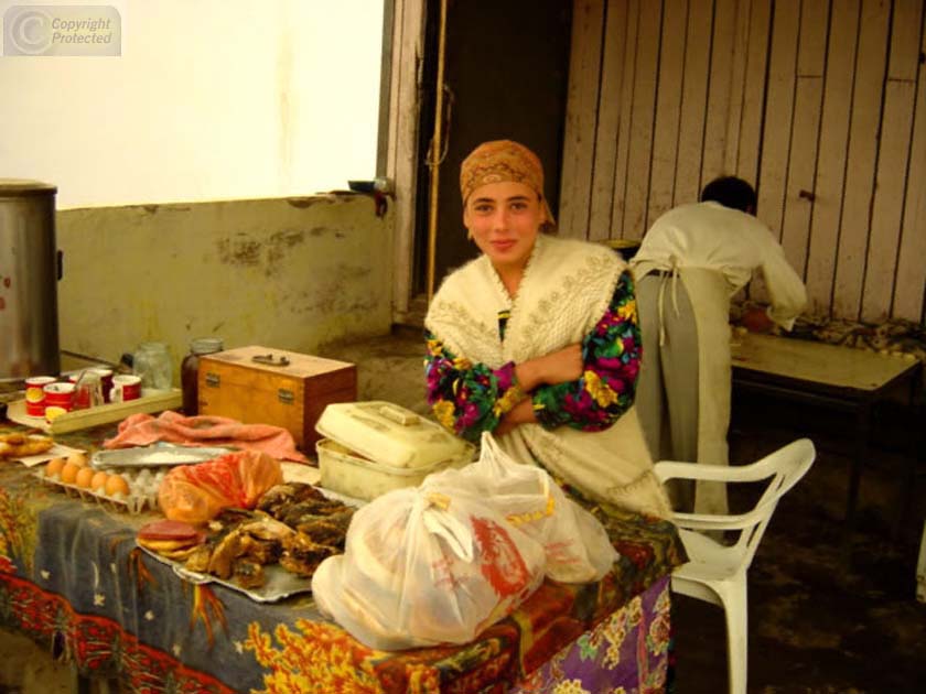 Girl Selling at a Stop in Tajikistan